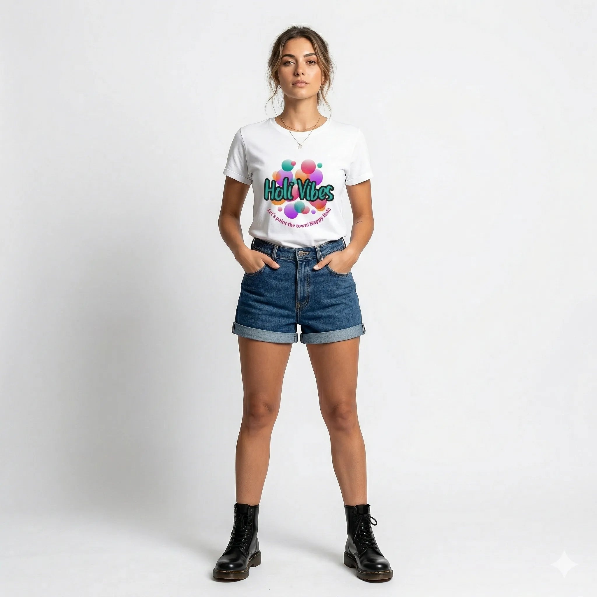 Woman wearing a white t-shirt with colorful text and design, standing against a plain background