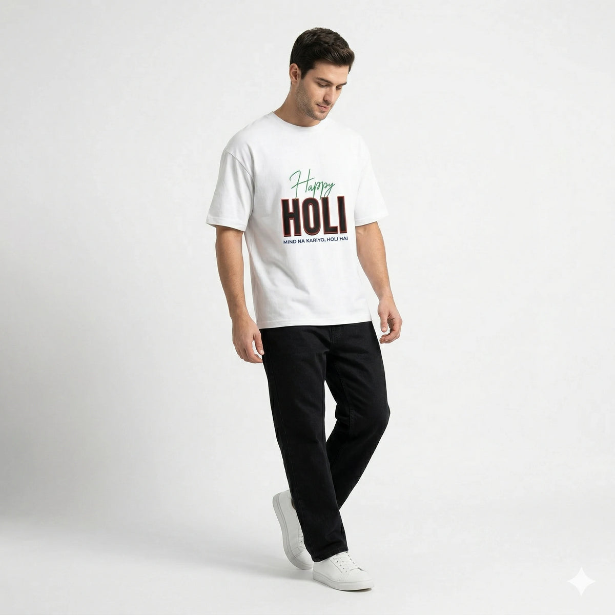 Man wearing a white t-shirt with 'Happy Holi' text on a plain background