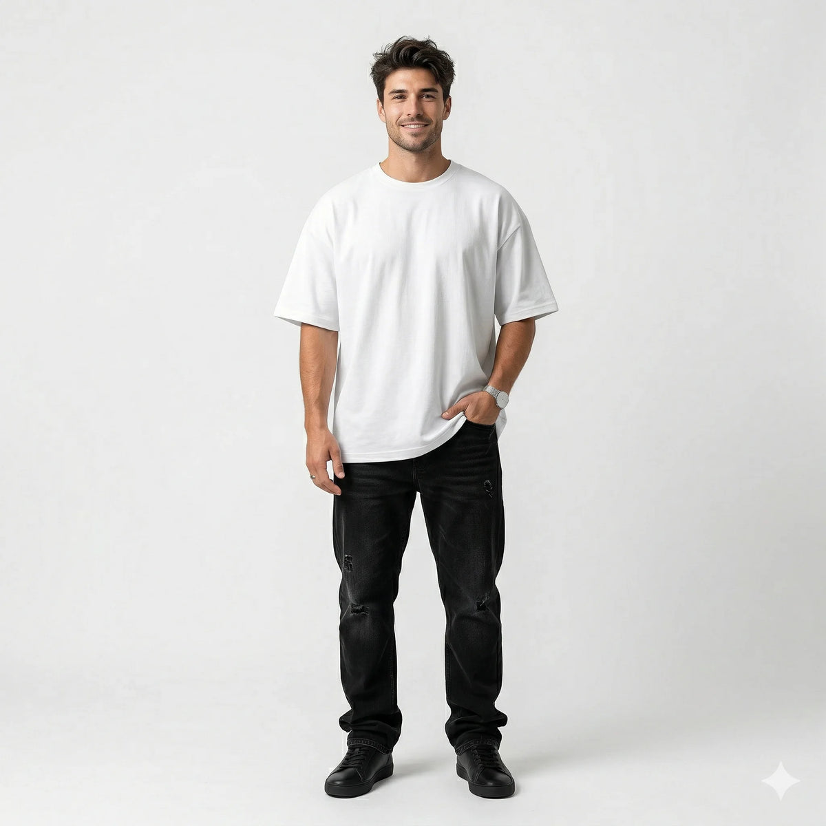 Man wearing a white t-shirt and black pants on a white background