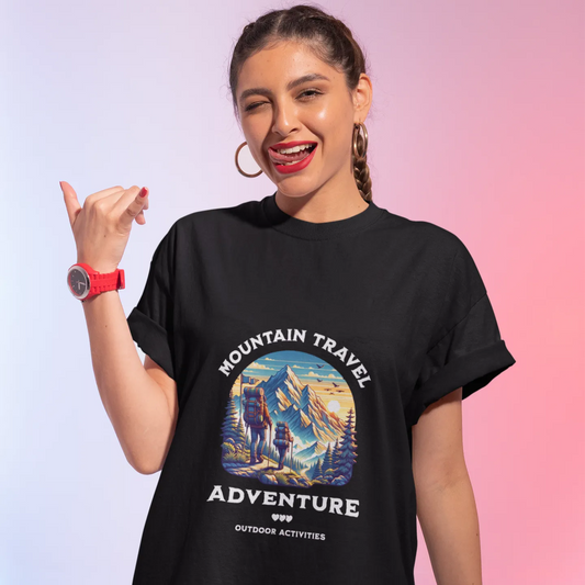 Woman wearing a black t-shirt with 'Mountain Travel Adventure' design on a gradient background