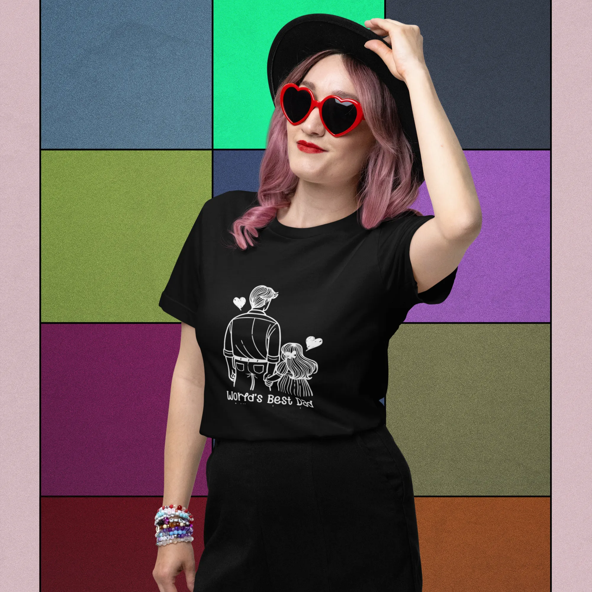 Person wearing a black t-shirt with a graphic design against a colorful geometric background