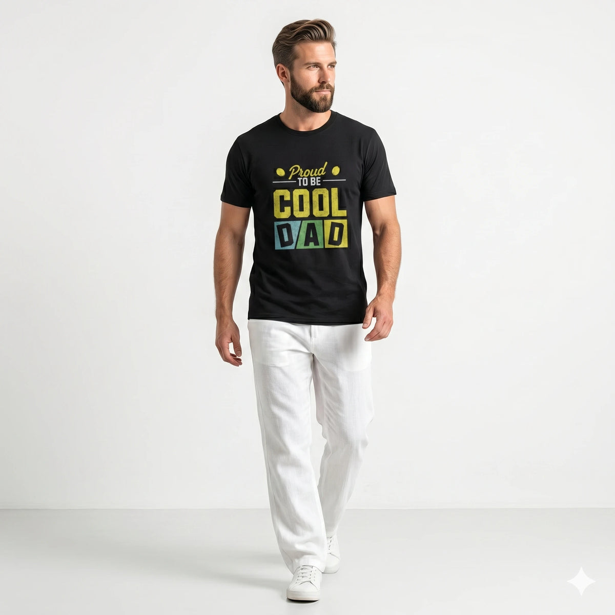 Man wearing a black t-shirt with colorful text 'Proud to be COOL DAD' on a gray background
