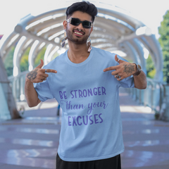 Man wearing a t-shirt with motivational quote in an outdoor setting