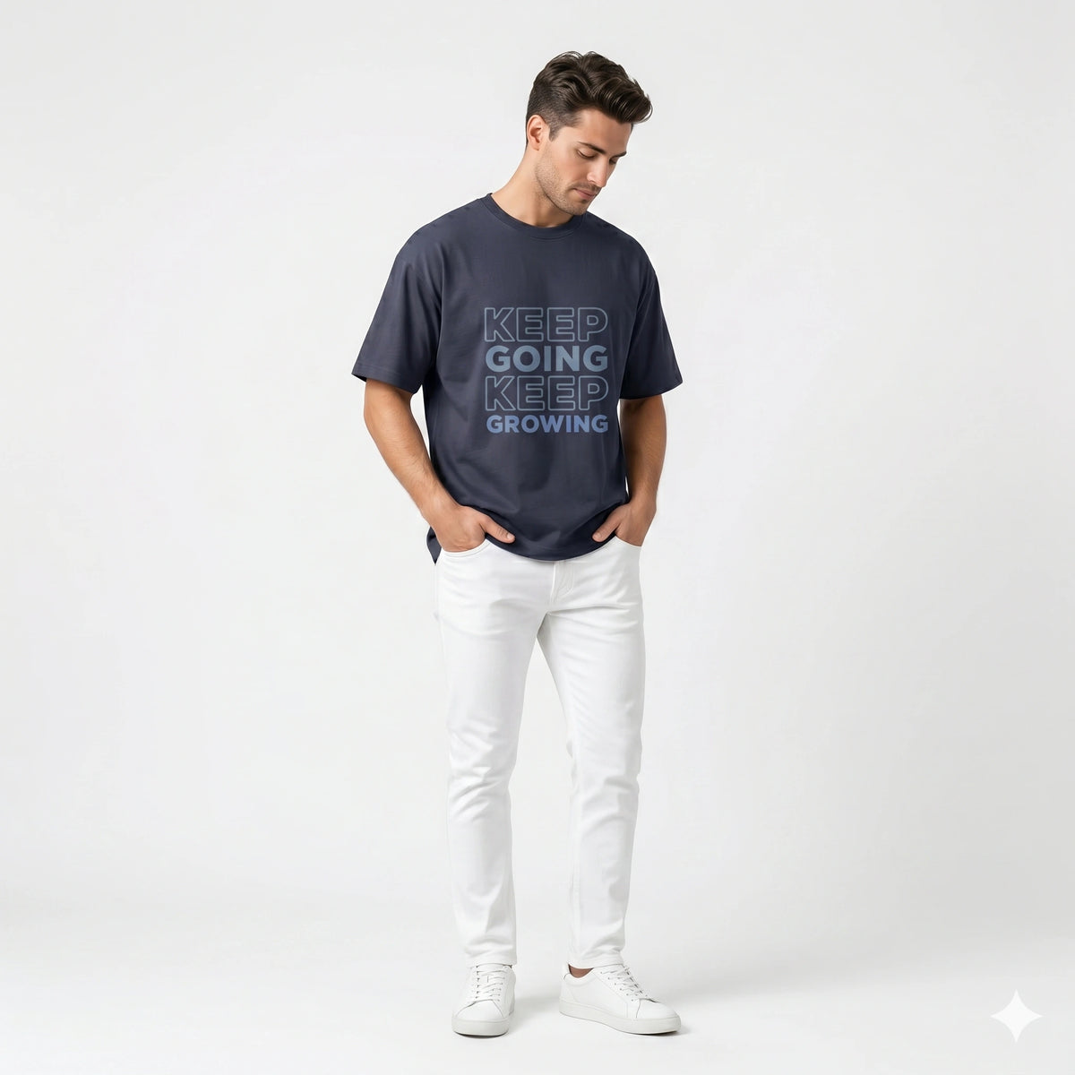 Man wearing a navy blue t-shirt with motivational text on a white background