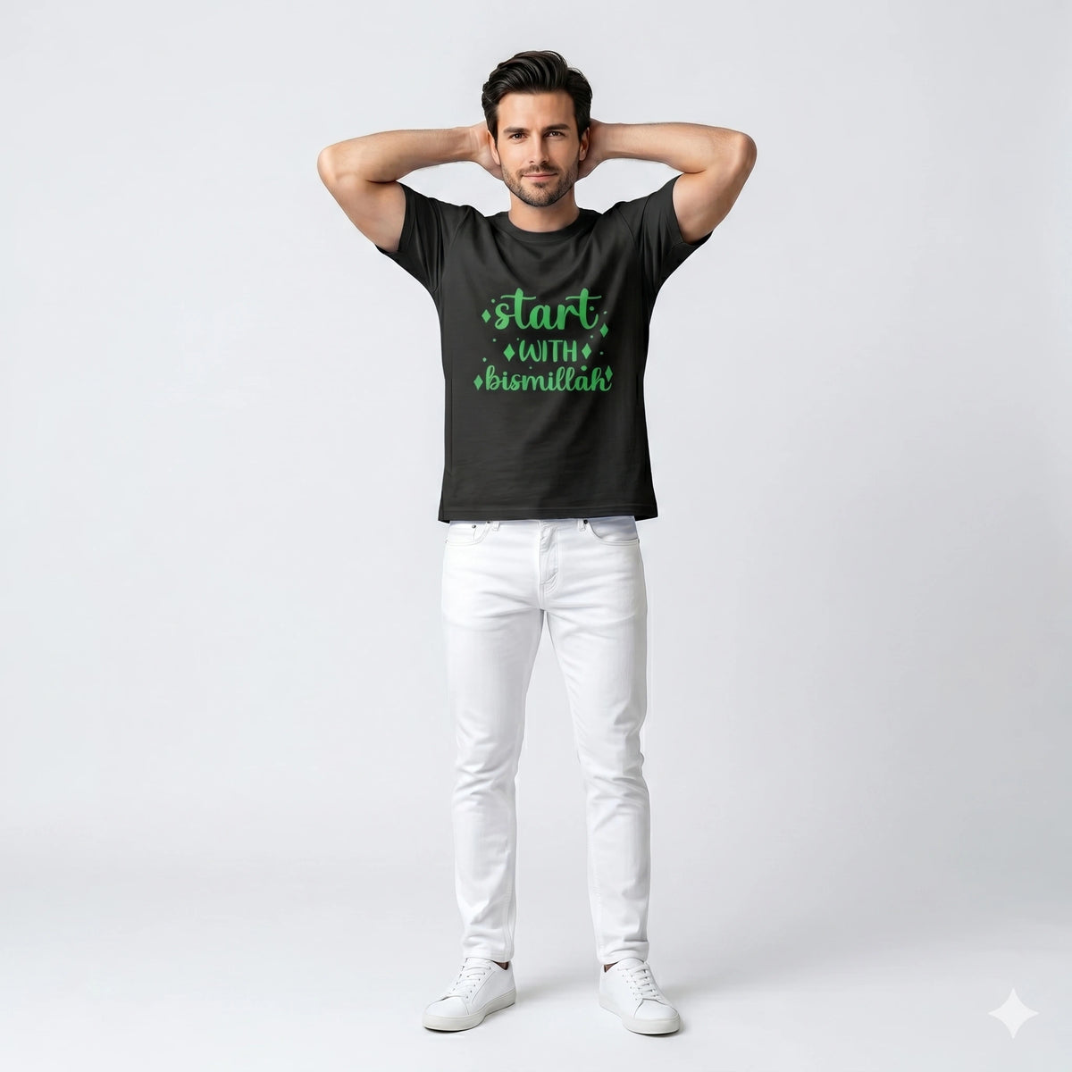 Man wearing a black t-shirt with green text on a white background