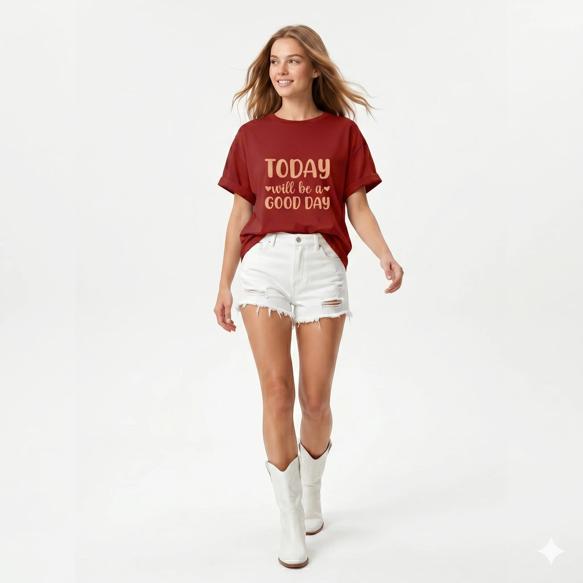 Woman wearing a red 'Today will be a good day' t-shirt with white shorts and boots on a light gray background
