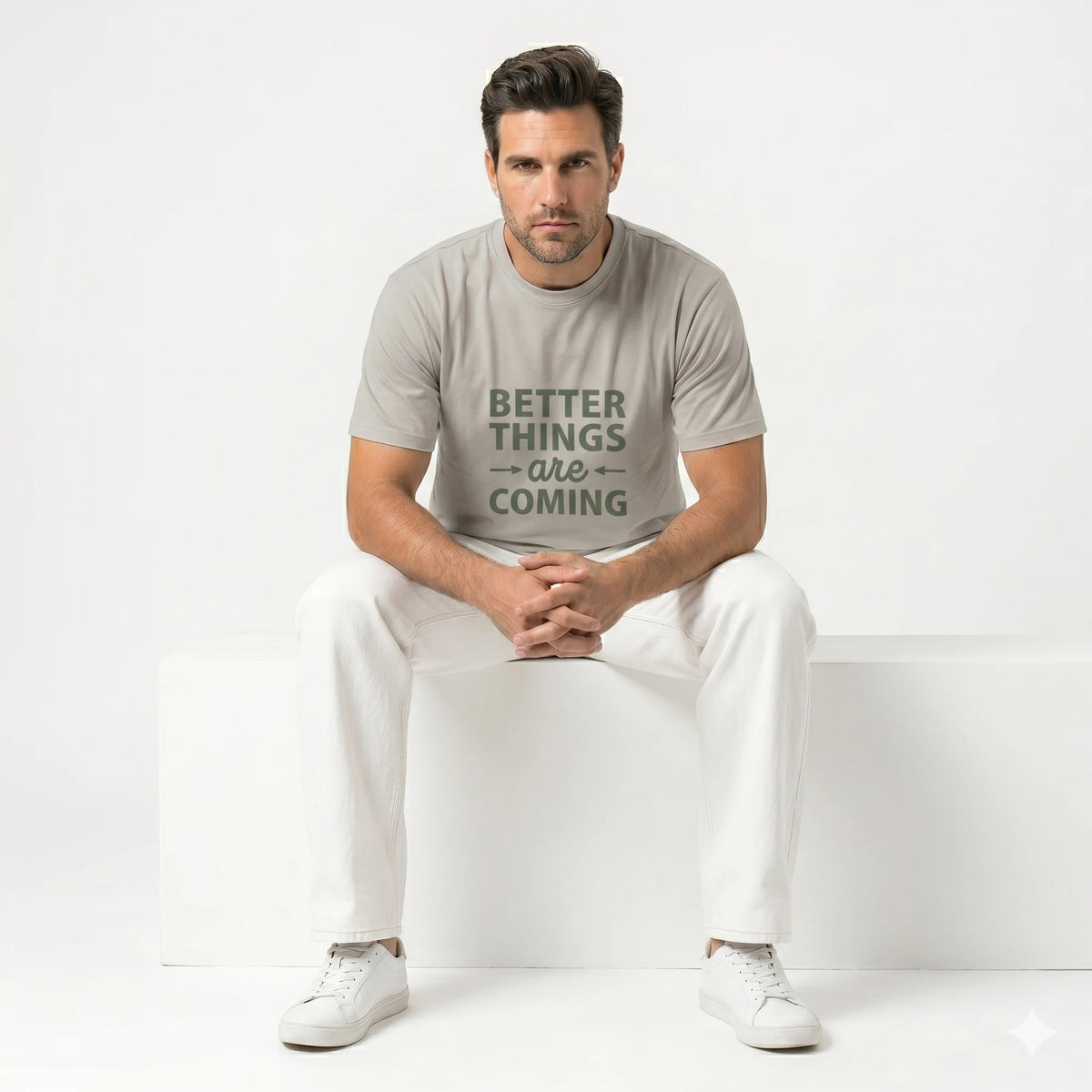 Person wearing a gray t-shirt with 'Better Things Are Coming' text against a bamboo background