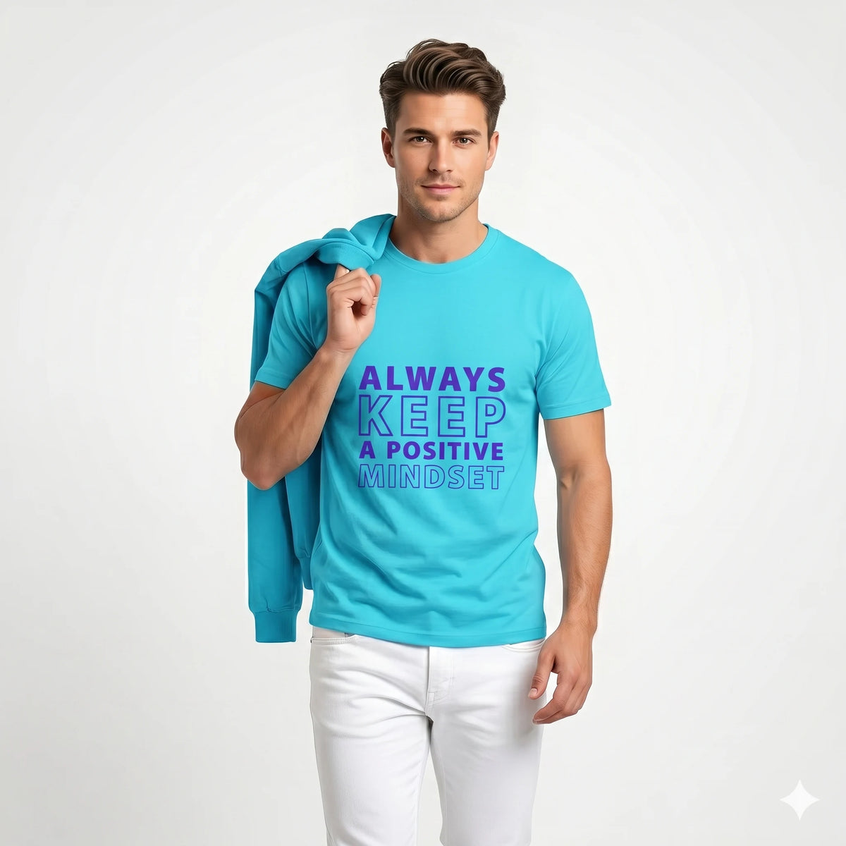 Person wearing a turquoise t-shirt with motivational text on a city street.