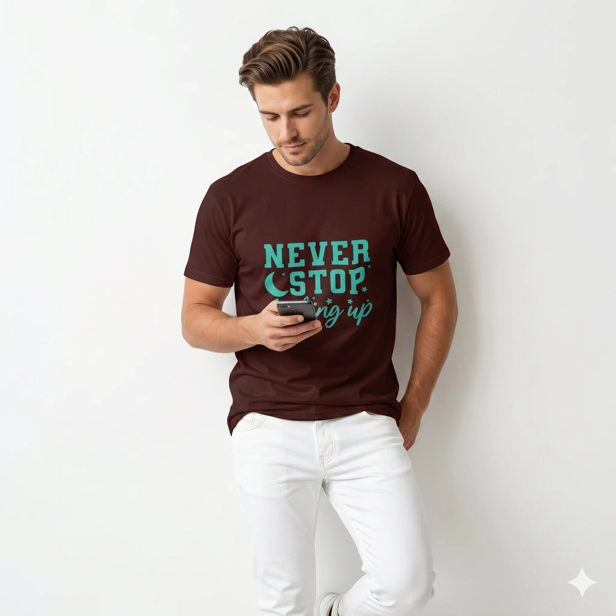 Man wearing a brown t-shirt with 'Never Stop Looking Up' text on a city street.