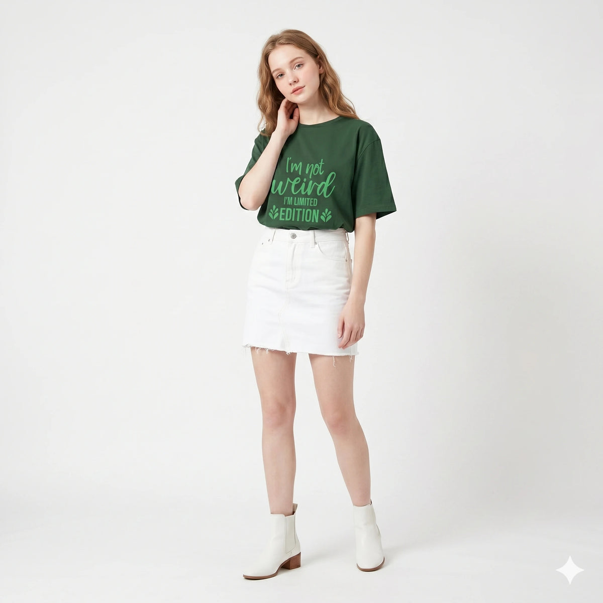 Woman wearing a green t-shirt with text and a white skirt on a white background