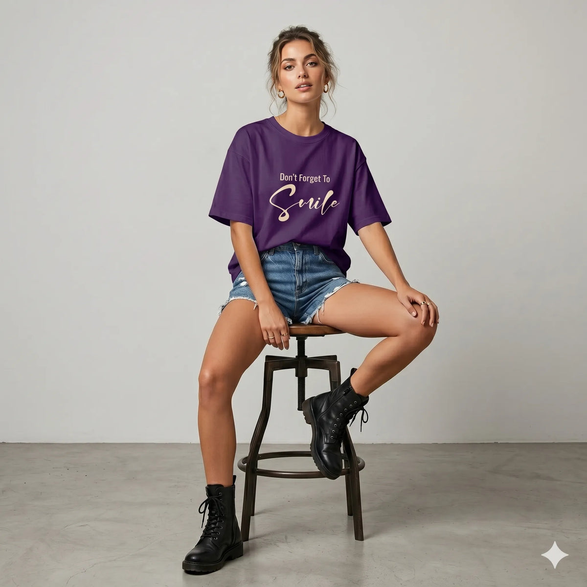 Woman wearing a purple t-shirt with 'Don't Forget To Smile' text outdoors.