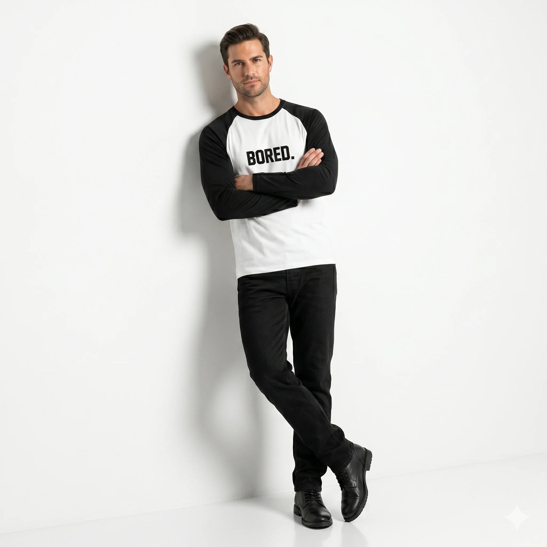 Man wearing a black and white long-sleeve shirt with 'BORED.' text on a white background