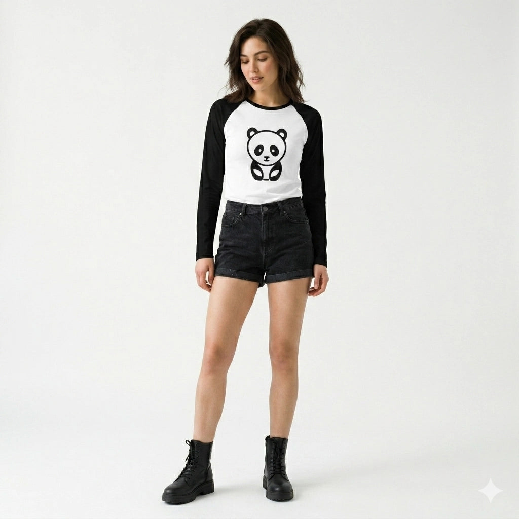 Woman wearing a black and white long-sleeve shirt with a panda design and black shorts on a white background
