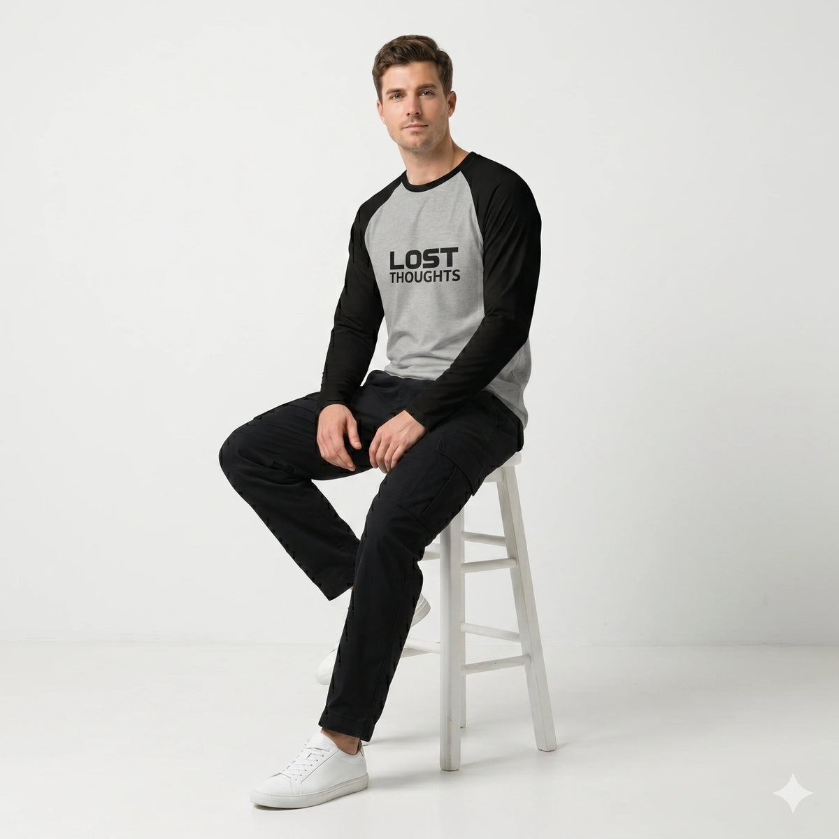 Person wearing a 'Lost Thoughts' shirt against a colorful background
