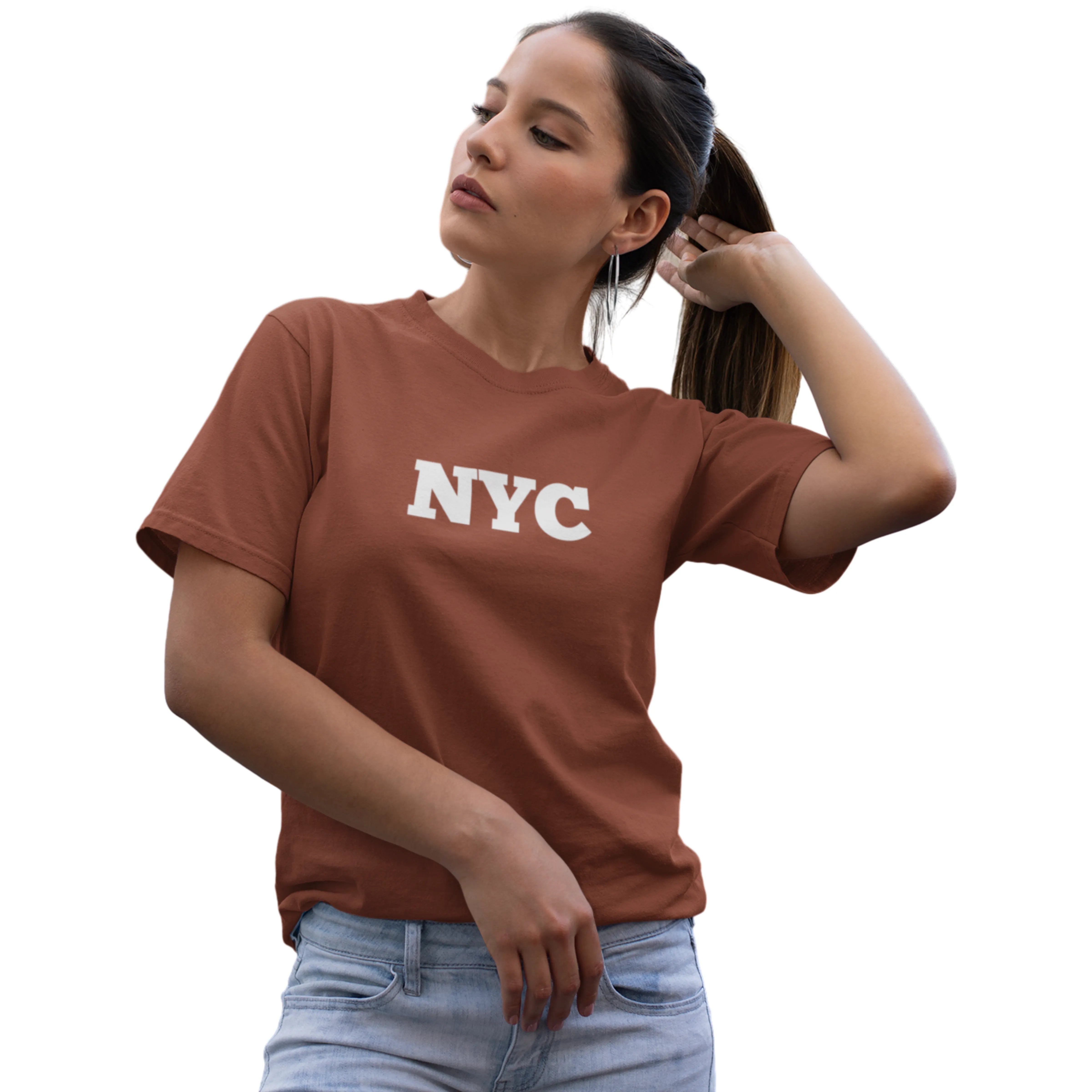 Woman wearing a brown 'NYC' t-shirt on a white background