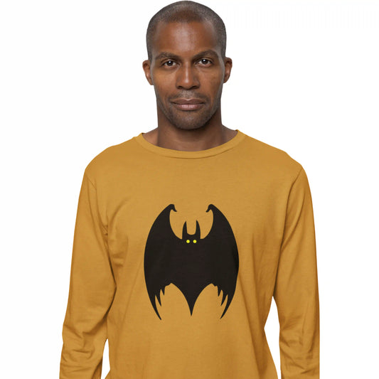 Man wearing a mustard yellow long-sleeve shirt with a black bat design on a white background