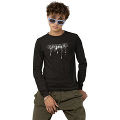 Child wearing a black long-sleeve shirt with 'Hustler' print and green pants on a white background