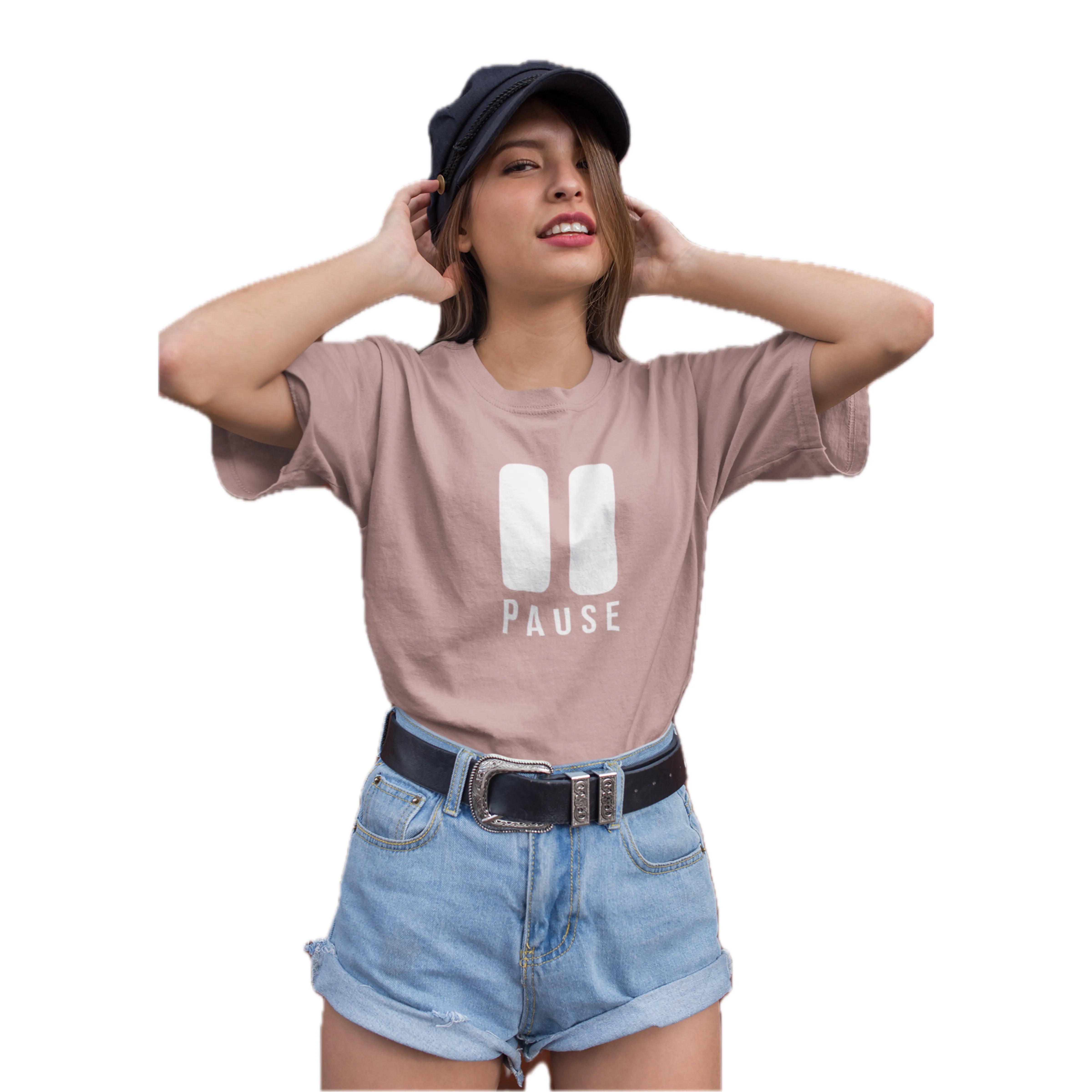 Woman wearing a pink t-shirt with 'PAUSE' design, blue shorts, and a black cap on a white background