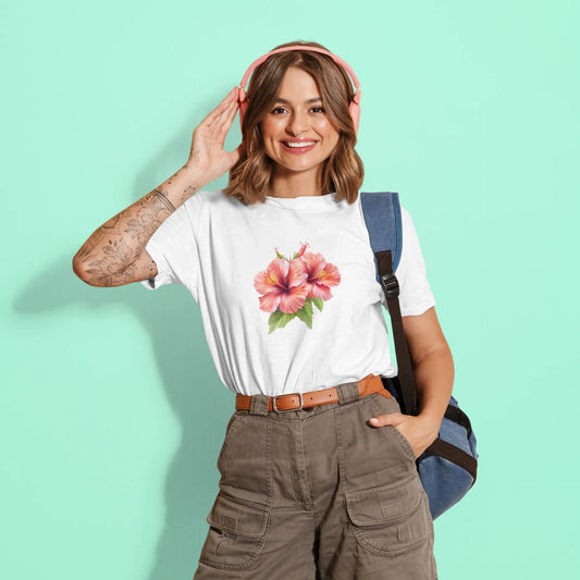 Woman wearing a white t-shirt with a floral design, brown pants, and a blue backpack on a light green background