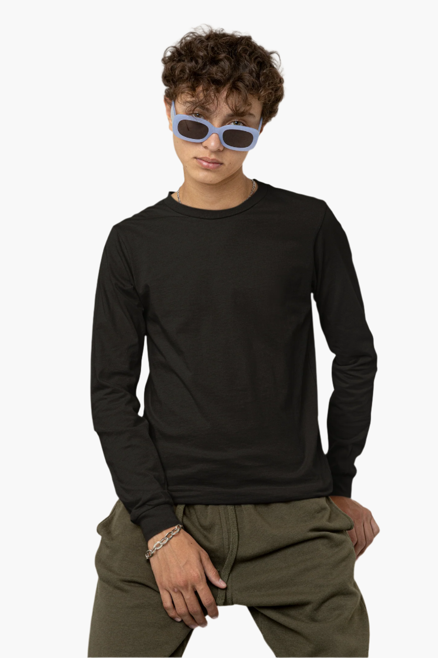 Person wearing a black long-sleeve shirt and green pants with blue sunglasses on a neutral background