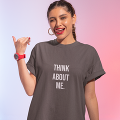 Woman wearing a gray t-shirt with 'THINK ABOUT ME.' text on a gradient background