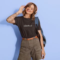 Woman wearing a black t-shirt with 'Unbothered' text on a blue background