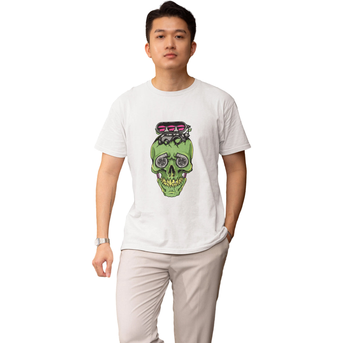 Person wearing a white t-shirt with a green skull design on a white background