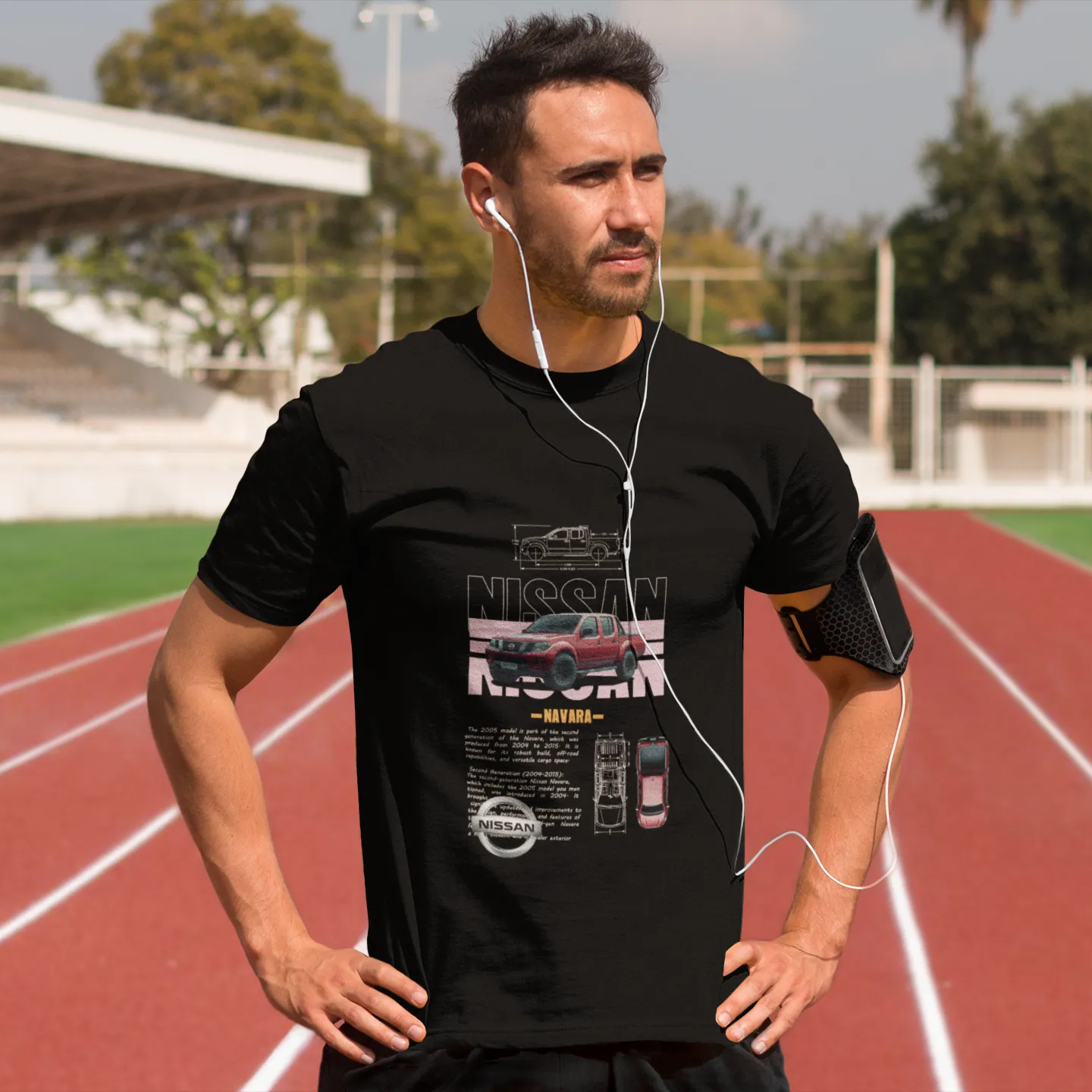 Man wearing a black t-shirt with a car brand logo on a running track