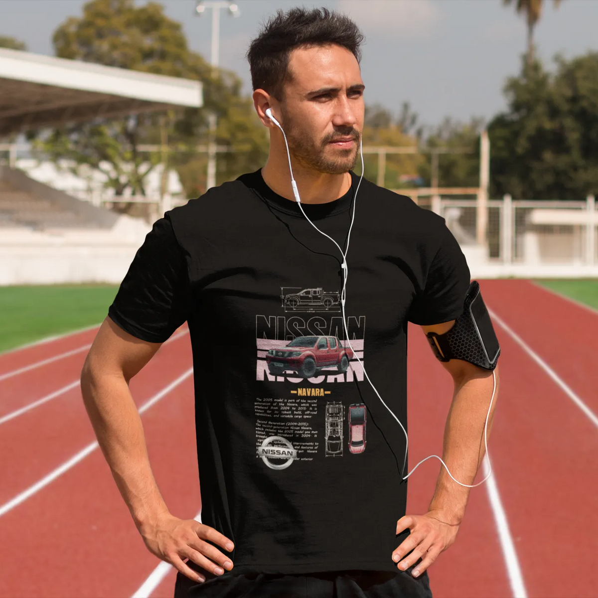 Man wearing a black t-shirt with a car brand logo on a running track