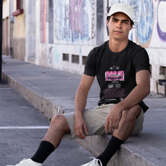 Person sitting on a ledge with graffiti in the background