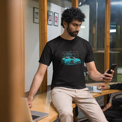 Two men in a casual setting, one using a phone and the other on a laptop.