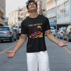 Man wearing a black t-shirt with graphic design on a city street