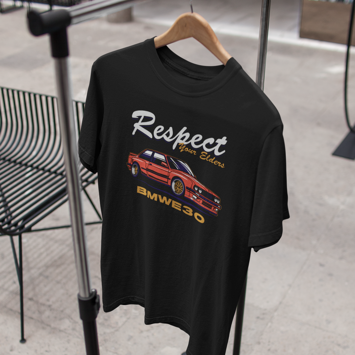 Black t-shirt with car graphic and 'Respect' text on a hanger
