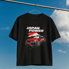 Black t-shirt with a red car graphic and 'Japan Power' text on a hanger against a blue sky.