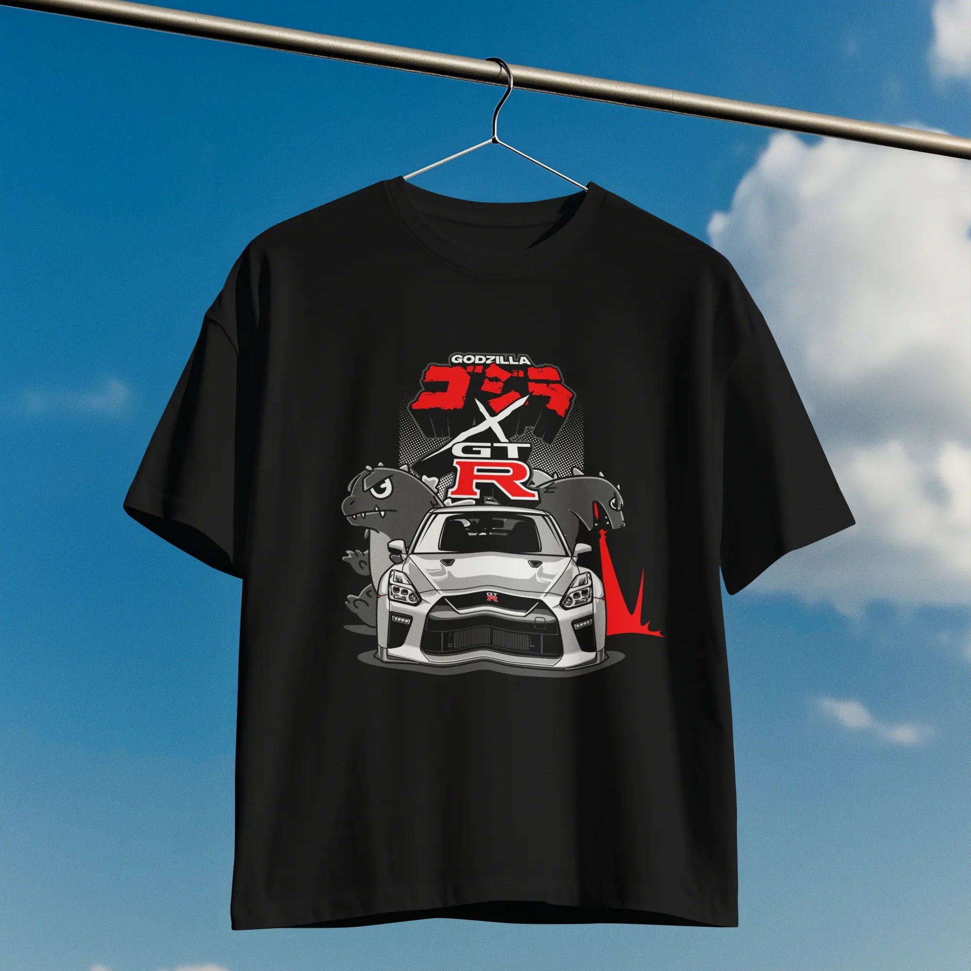 Black t-shirt with car graphic and 'R' logo on a clothesline against a blue sky.