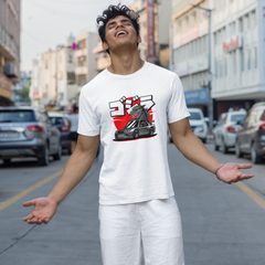 Person wearing a white t-shirt with a graphic design on a city street.