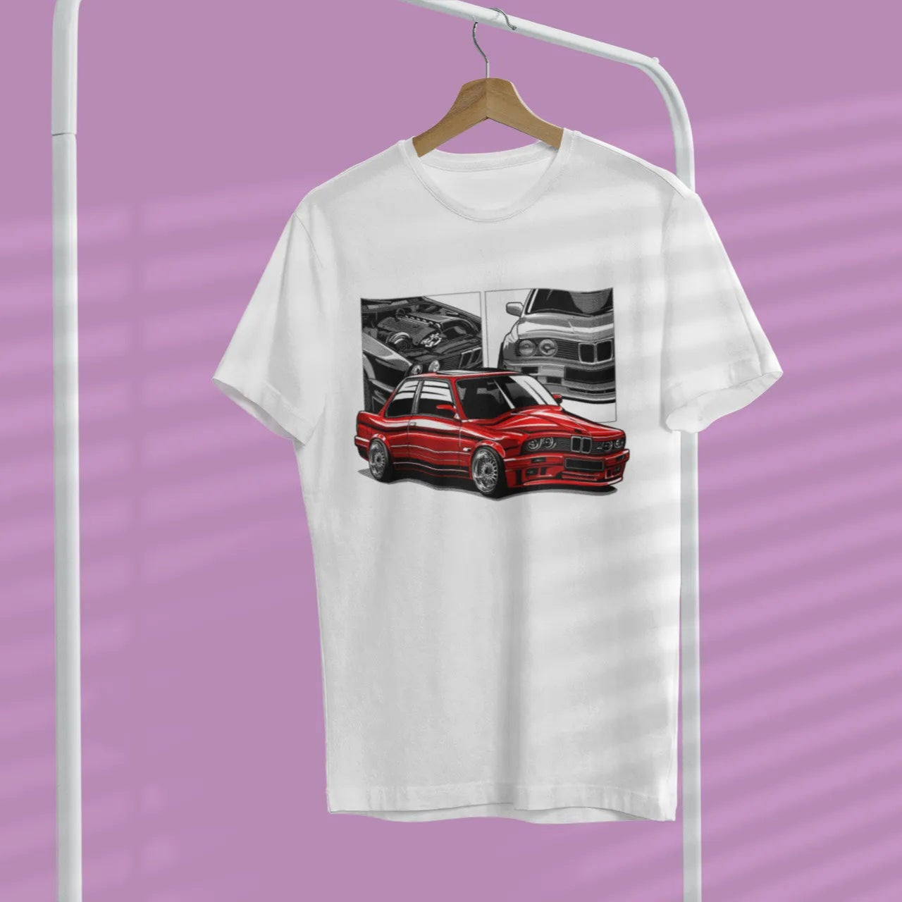 White t-shirt with red car graphic on a hanger against a purple background