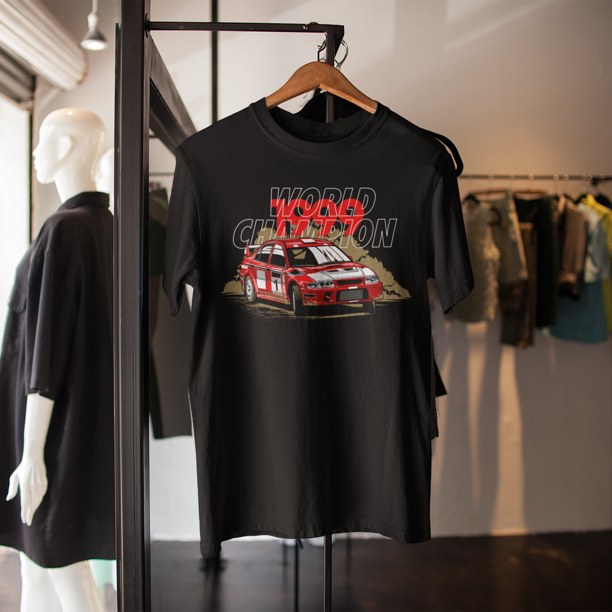 Black t-shirt with car graphic and 'World Champion' text on a hanger in a store setting.