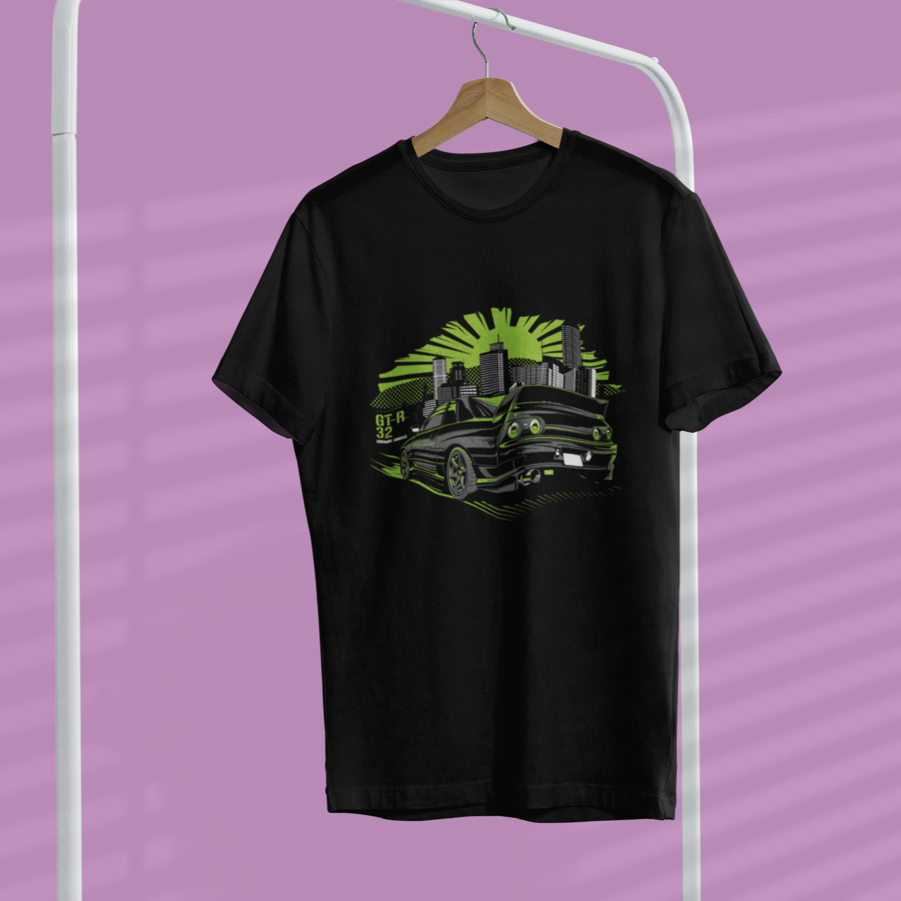 Black t-shirt with a green graphic design on a hanger against a purple background