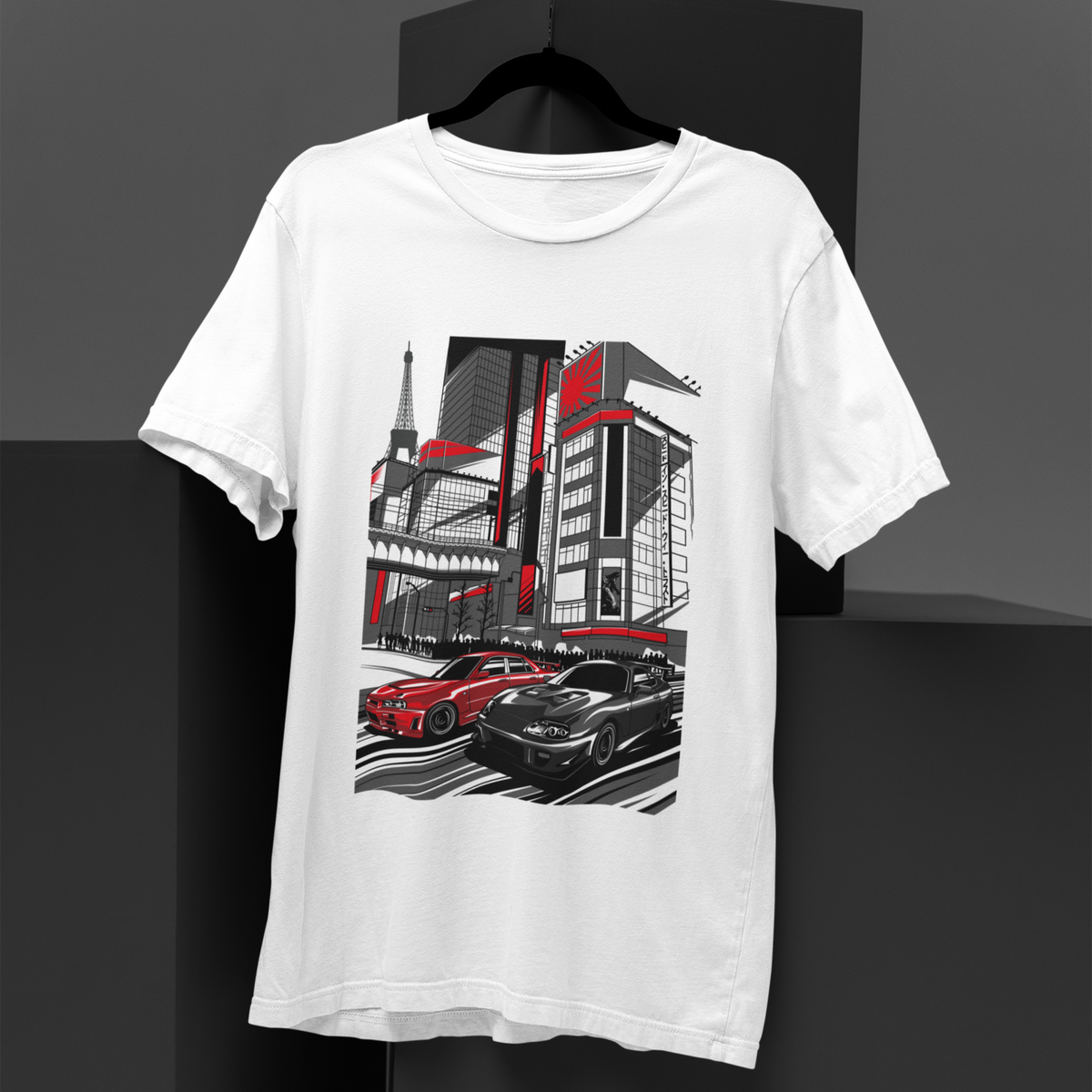 White t-shirt with a graphic design of cars and buildings on a black background