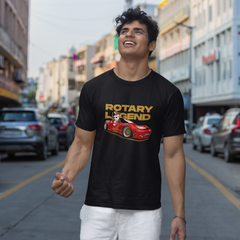 Man wearing a black t-shirt with 'Rotary Legend' graphic on a city street.