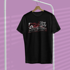 Black t-shirt with graphic design on a hanger against a purple background