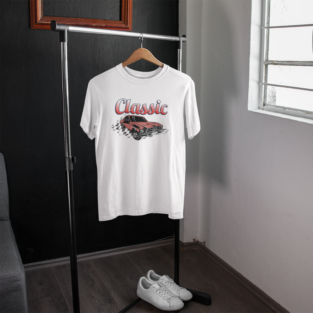 White t-shirt with a graphic design of a car and 'Classic' text on a hanger in a room.