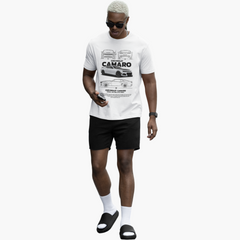Man wearing a white t-shirt with a car graphic and text, black shorts, and sandals on a white background