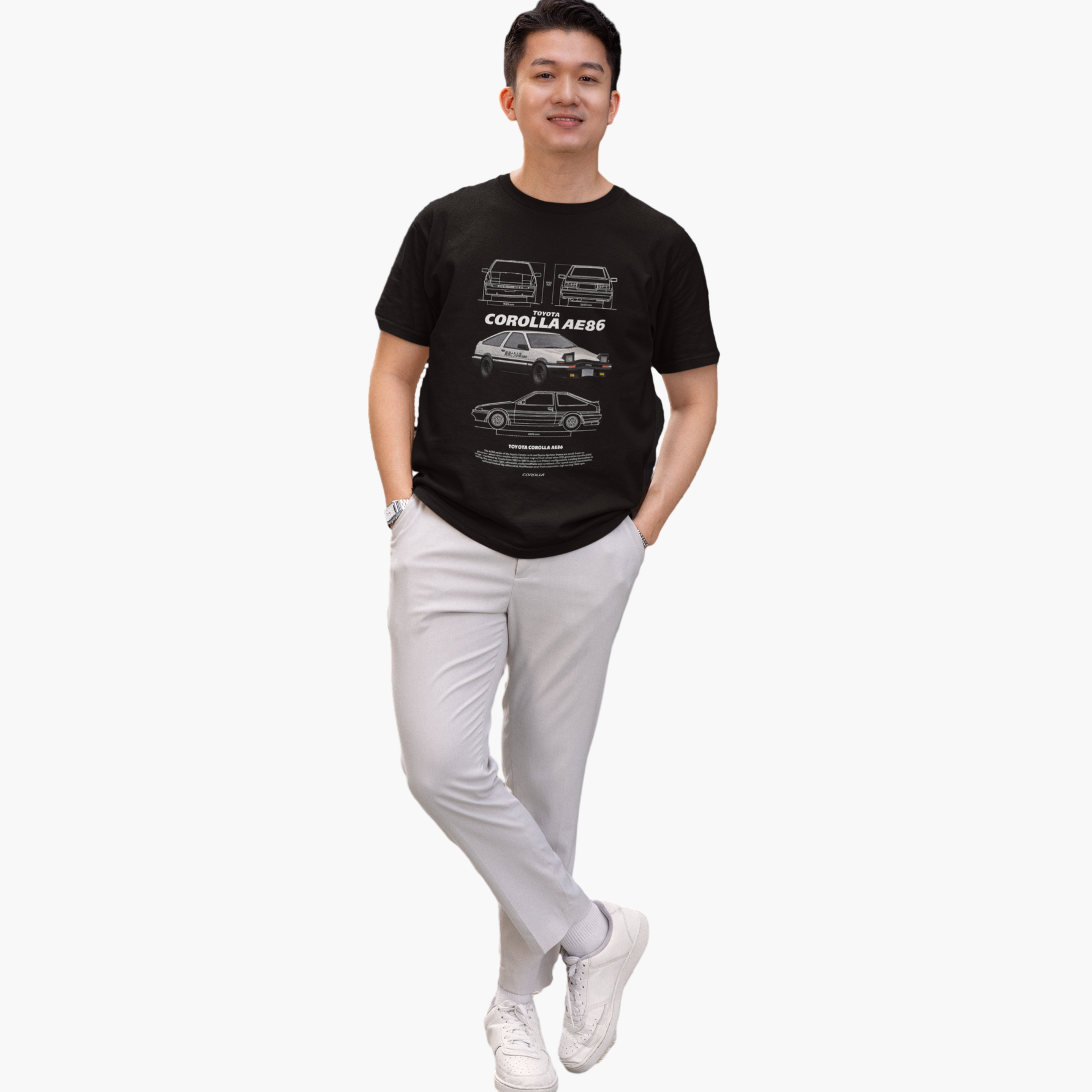 Person wearing a black t-shirt with car graphics on a white background