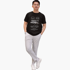 Person wearing a black t-shirt with car graphics on a white background