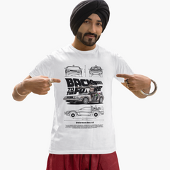 Man wearing a white t-shirt with 'Back to the Future' design, pointing at the shirt.