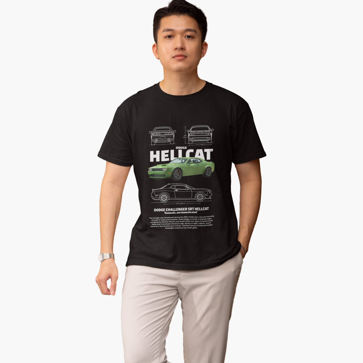 Person wearing a black t-shirt with car graphics and text on a white background