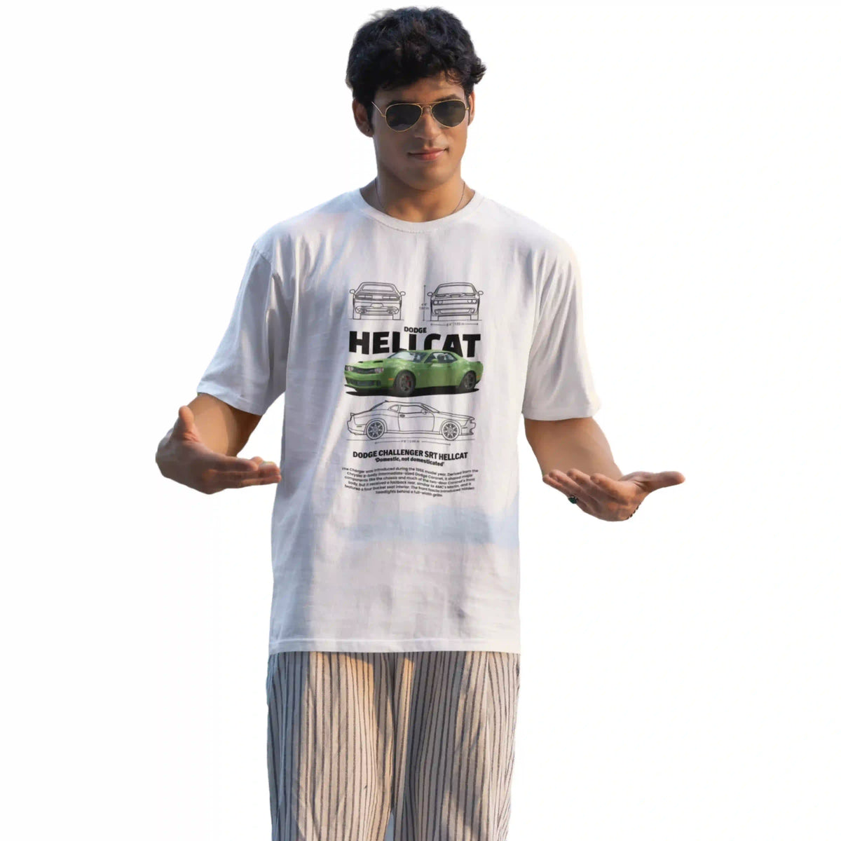 Person wearing a white t-shirt with a graphic design on a white background