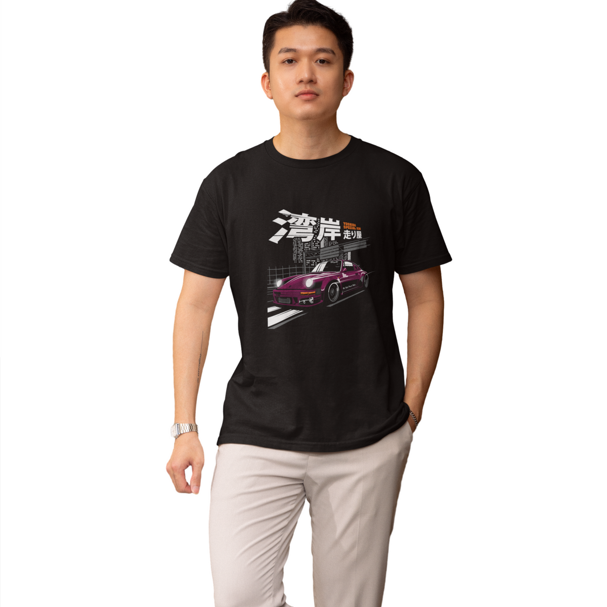 Person wearing a black t-shirt with a graphic design on a white background